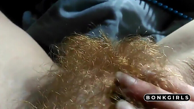 Hairy redhead girl pleasuring herself